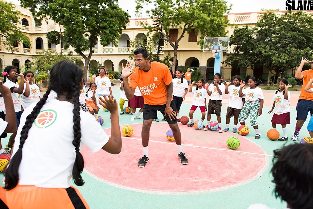 Dr. Tummala coaching young players at a Crossover Basketball and Scholars Academy clinic in Chennai, India