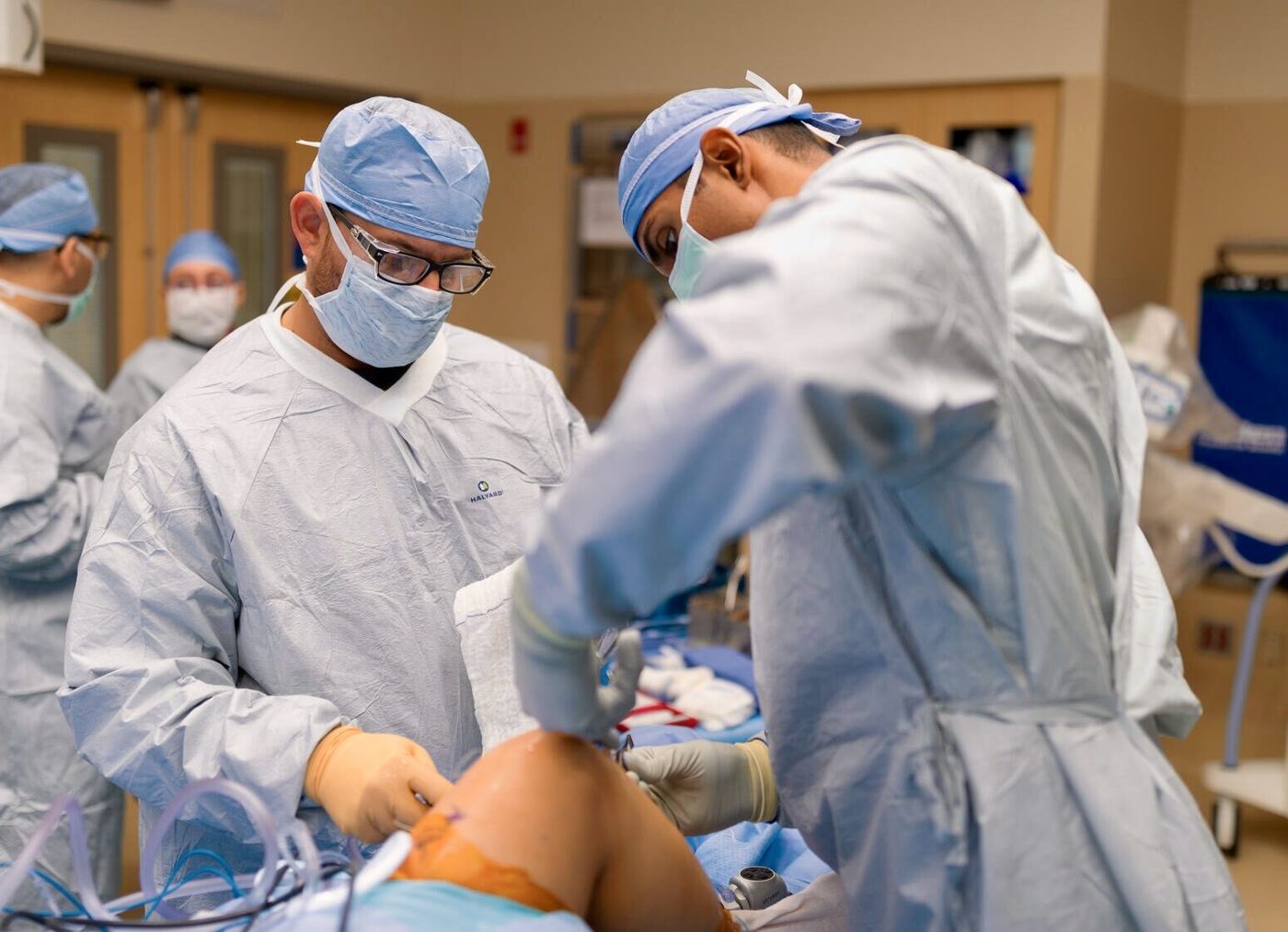 Dr. Tummala operating with the surgical team