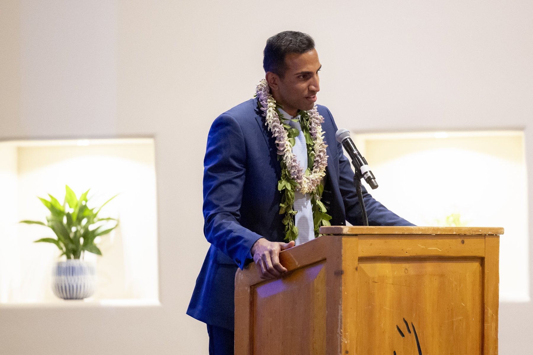 Dr. Tummala speaking at a podium